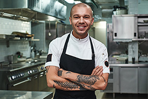 Young chef in kitchen